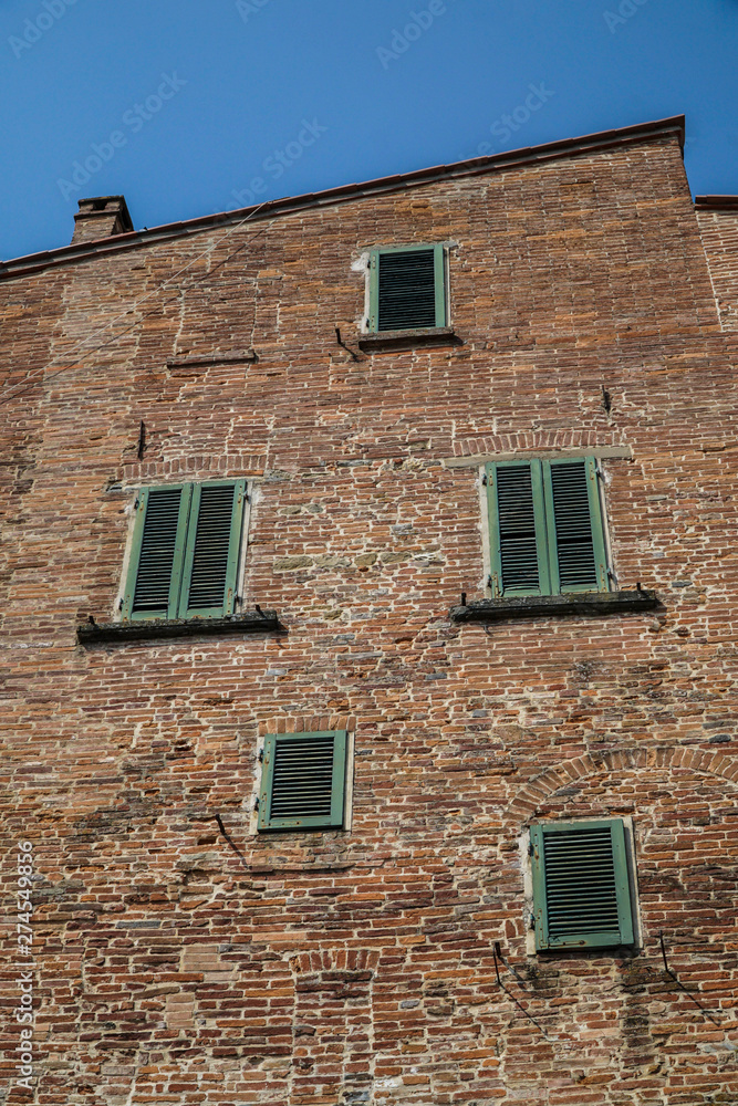 green window blinds of a brick house green window blinds of a brick house