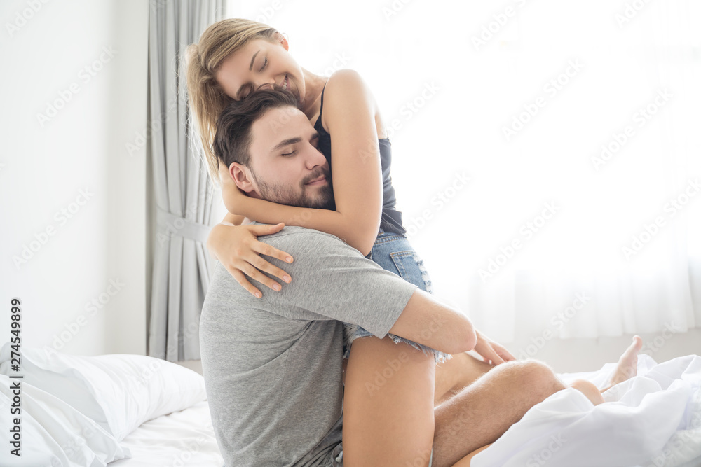 Young couple hugging in the bed .loving couple in bedroom Stock Photo |  Adobe Stock