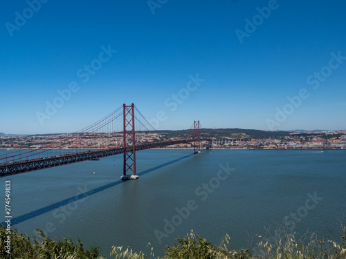 Portugal, may 2019: The 25 April bridge (Ponte 25 de Abril) is a steel suspension bridge located in Lisbon, crossing the Targus river. It is one of the most famous landmarks of the region.