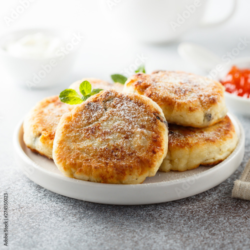 Homemade cottage cheese pancakes on white plate