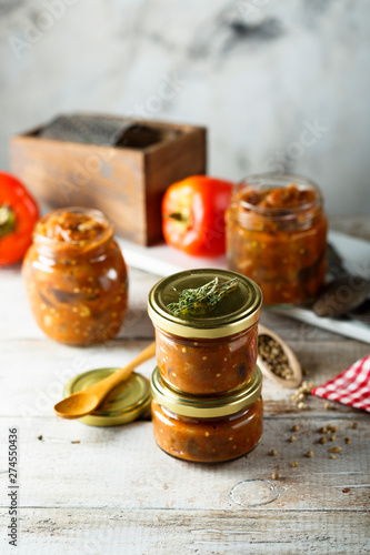 Homemade roasted vegetables sauce in jars