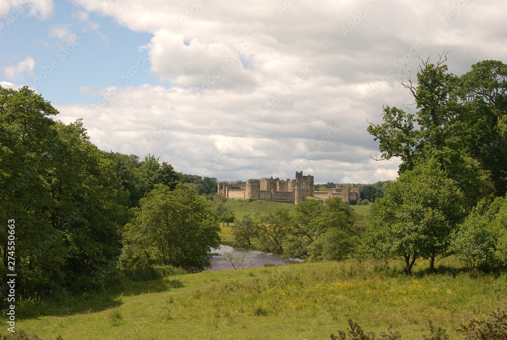 Alnwick castle and river Aln in Northumberland in summer