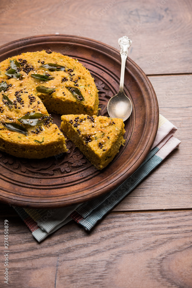 Handvo/handwa is a vegetable cake originating from the Gujarat, India. selective focus Handvo/handwa is a vegetable cake originating from the Gujarat, India. selective focus