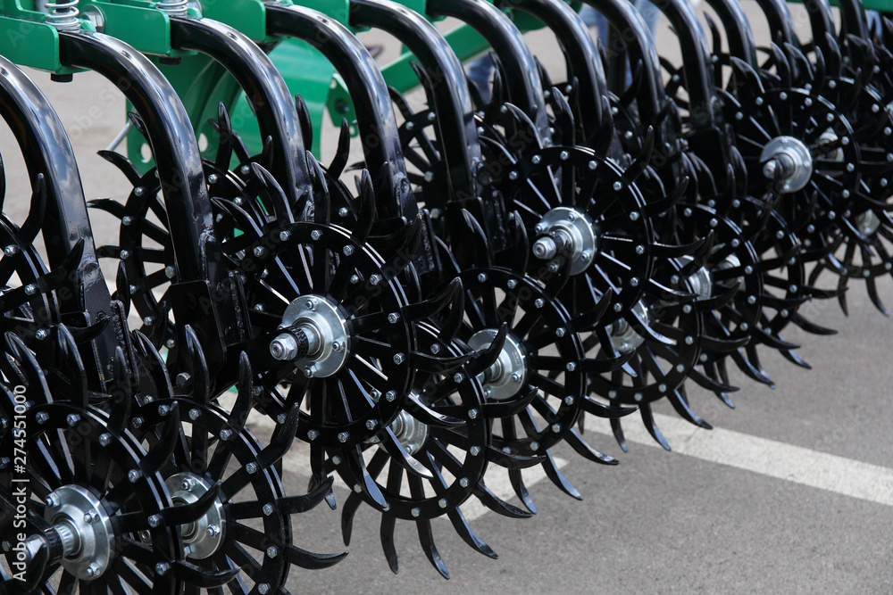Detail of an agricultural machine on display at an agricultural fair Detail of an agricultural machine on display at an agricultural fair