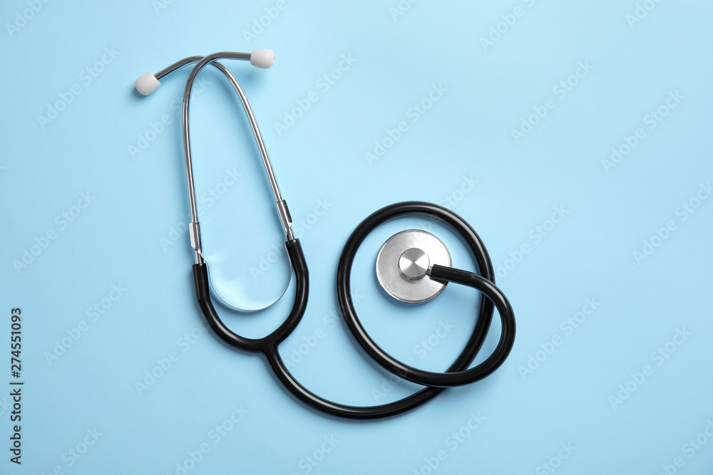 Stethoscope on color background, top view. Medical tool Stethoscope on color background, top view. Medical tool