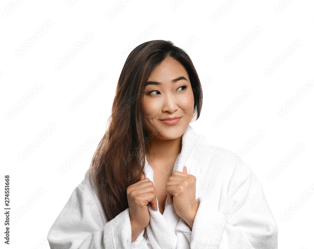 Portrait of beautiful Asian woman in bathrobe isolated on white. Spa treatment Portrait of beautiful Asian woman in bathrobe isolated on white. Spa treatment