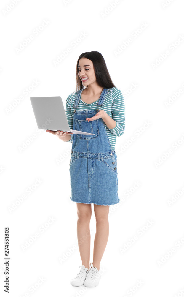 Full length portrait of young woman in casual outfit with laptop on white background Full length portrait of young woman in casual outfit with laptop on white background