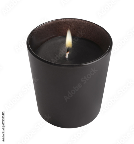 Aromatic burning candle in black holder isolated on white