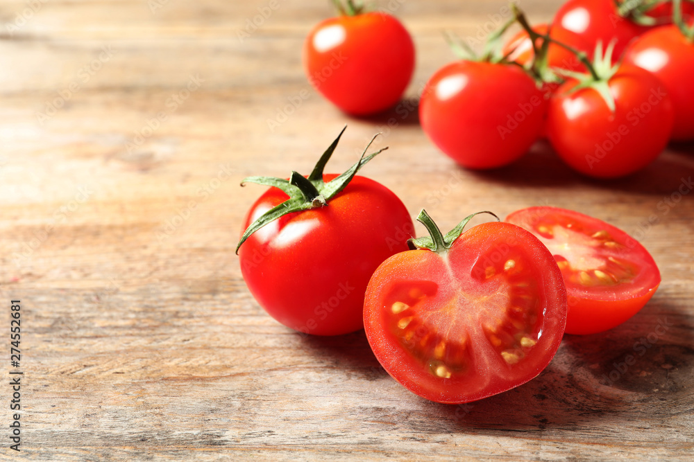 Fresh cherry tomatoes on wooden background. Space for text Fresh cherry tomatoes on wooden background. Space for text