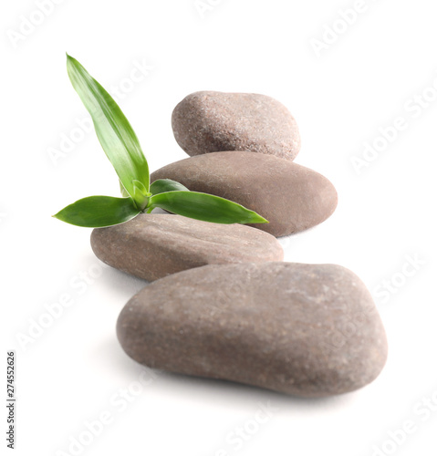 Spa stones with bamboo isolated on white