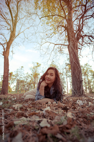 Young asian woman in an autumn park