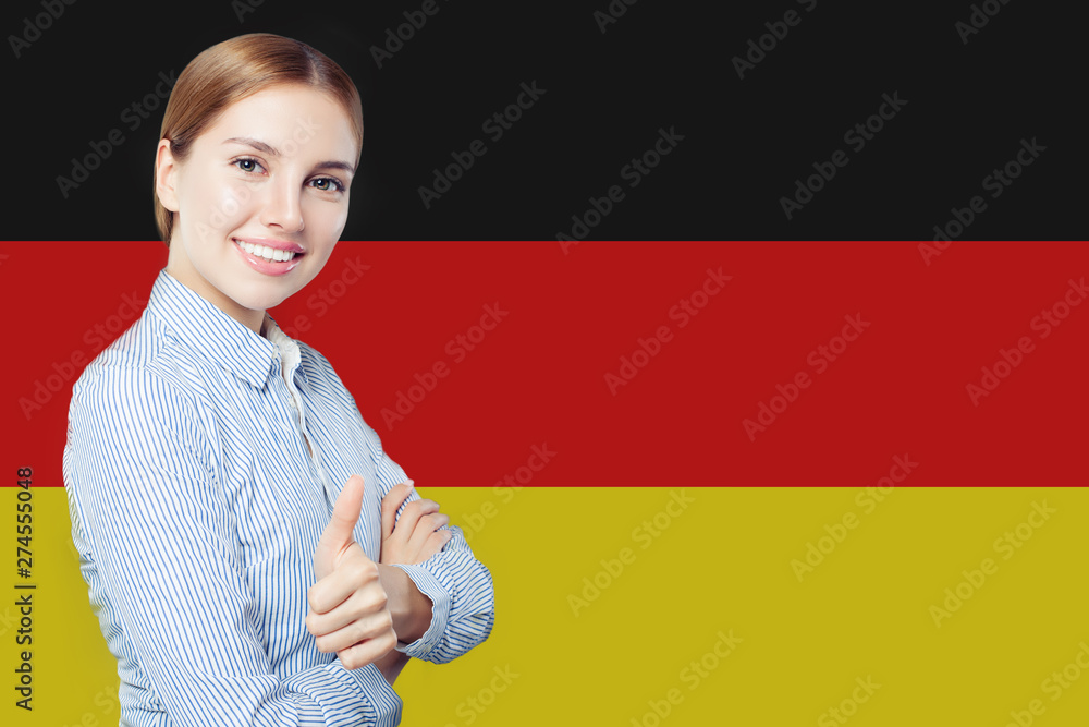 Travel in Germany concept. Pretty busineswoman showing thumb up against the Germany flag background - obrazy, fototapety, plakaty 