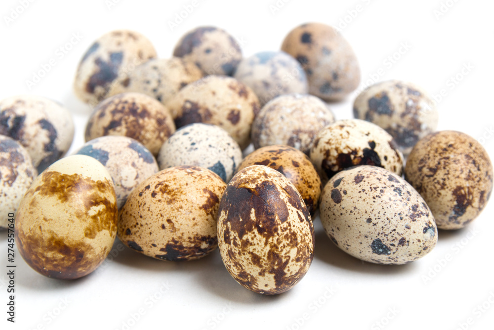 quail eggs close up on white background