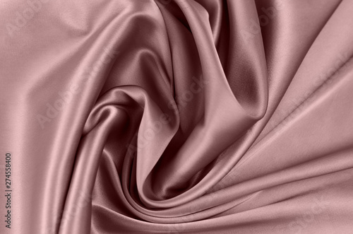 Background from satin fabric of brown color.