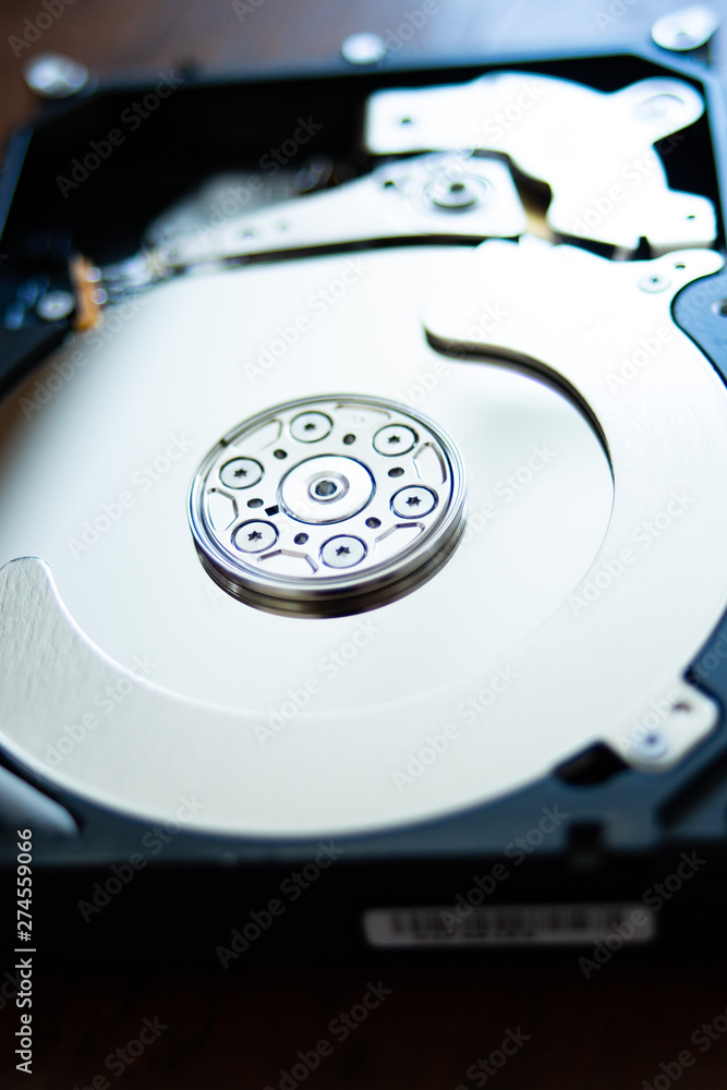 open hard disk pc with surface and electronic parts visible. hardware computer open hard disk pc with surface and electronic parts visible. hardware computer