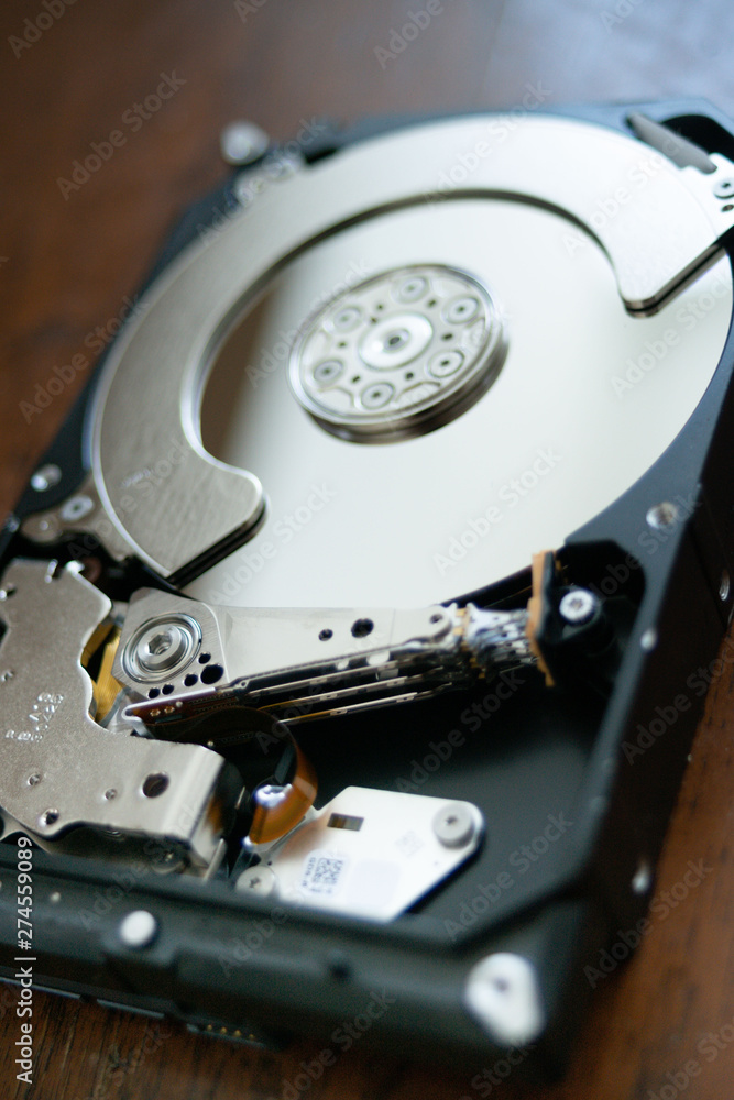 open hard disk pc with surface and electronic parts visible. hardware computer open hard disk pc with surface and electronic parts visible. hardware computer