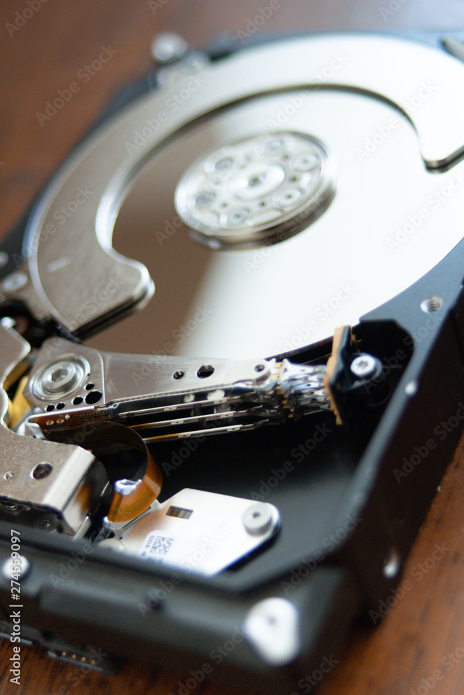open hard disk pc with surface and electronic parts visible. hardware computer open hard disk pc with surface and electronic parts visible. hardware computer