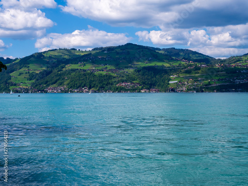 Spiez, Switzerland - May 30th 2019: Thun lake view from Spiez Ferry port. © Keerathi