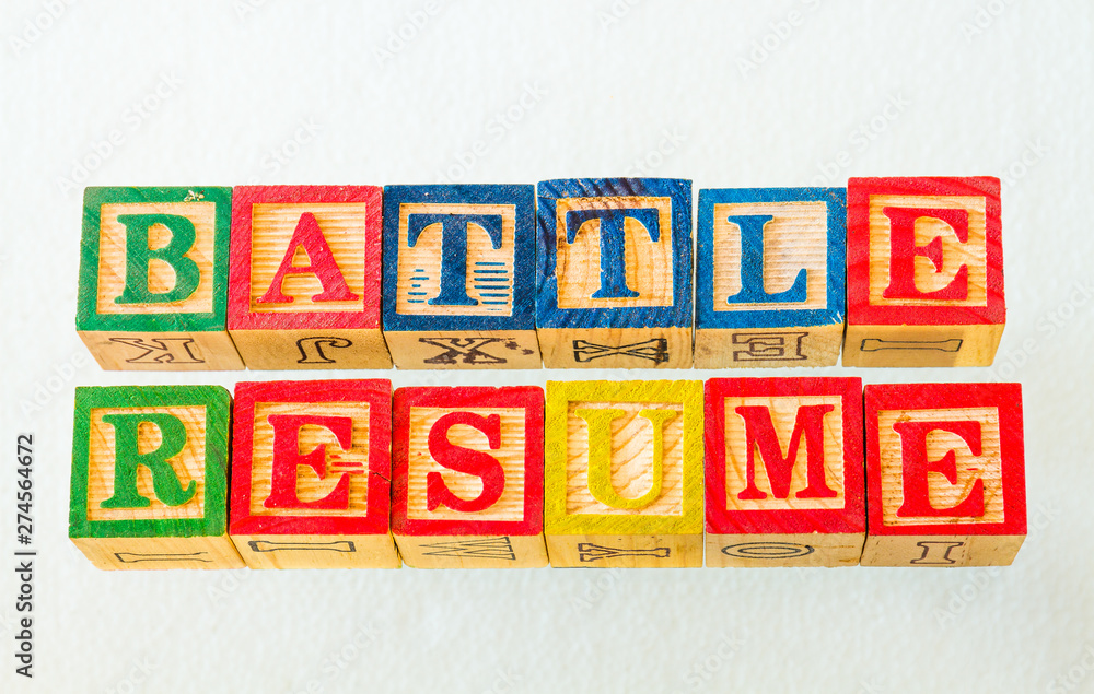 The term battle resume visually displayed on a clear background using colorful wooden blocks image in landscape format with copy space