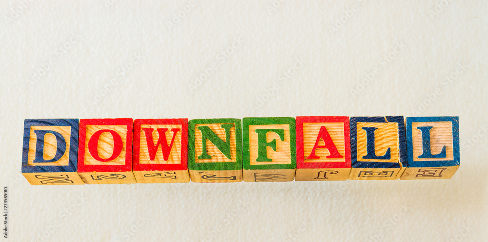 The term downfall visually displayed on a clear background using colorful wooden blocks image in landscape format with copy space
