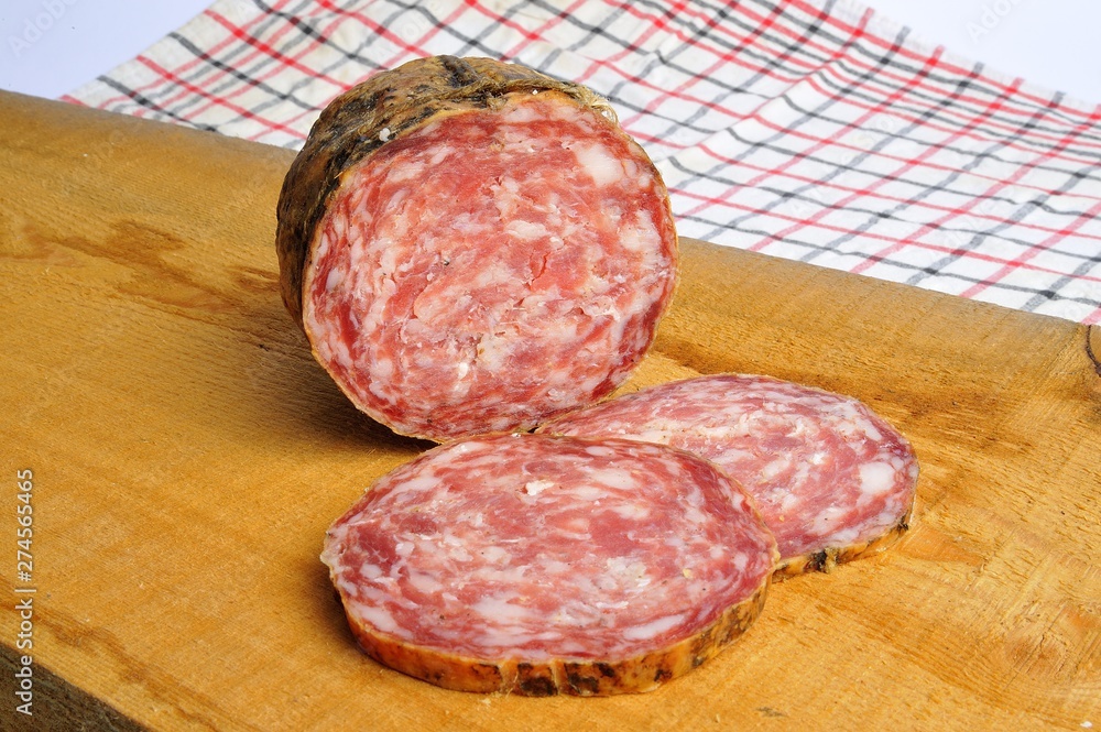 typical traditional Italian salami with bread and suppressed for a snack with healthy food typical traditional Italian salami with bread and suppressed for a snack with healthy food