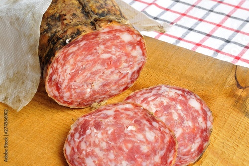 typical traditional Italian salami with bread and suppressed for a snack with healthy food