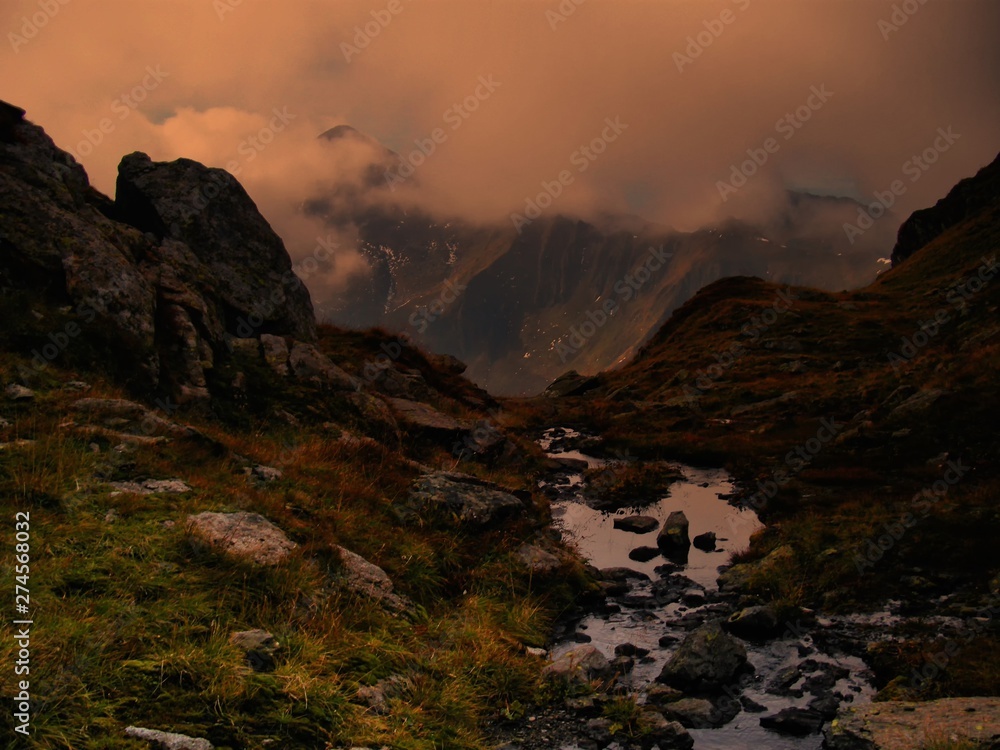 High altitude scenic mountain landscape with brook