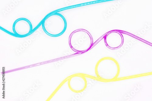 colored tubes for beautifully shaped cocktails, close-up on a white background
