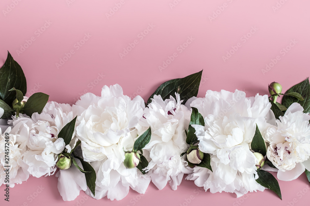 Design concept - top view of bunch of beautiful flowers on colored background with copy space