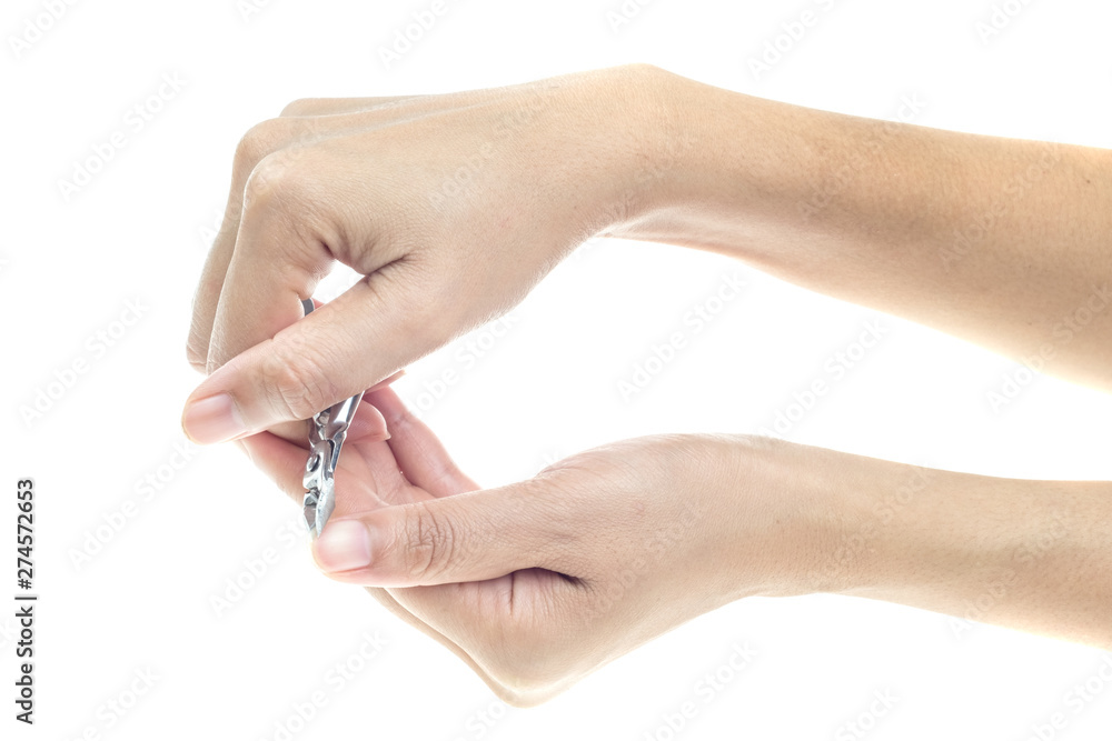 Woman hands using a nail clippers to cut her fingernails. Woman hands using a nail clippers to cut her fingernails.