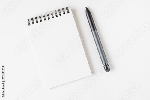 Open notebook on a spiral on a light background. Place for text. The concept of learning, sketch, writing. Flat lay, minimalism, top view, design.