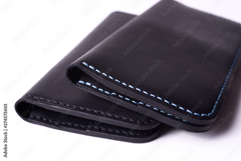 Two handmade leather black purse isolated on white background. Stock photo of luxury accessories. Two handmade leather black purse isolated on white background. Stock photo of luxury accessories.