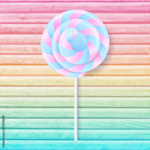 colorful lollipop on green background
