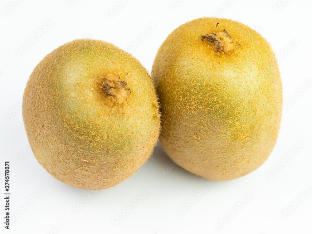 Two green kiwi fruit, isolated on a white background. Two green kiwi fruit, isolated on a white background.