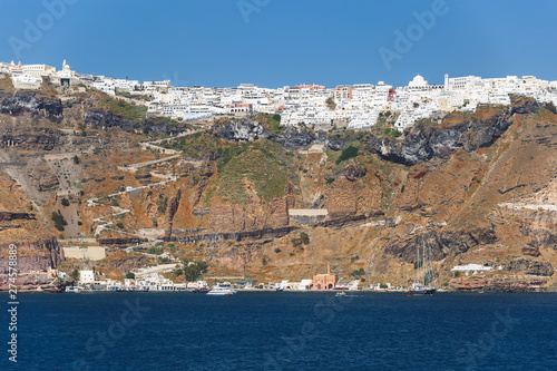Panoramic unique view along the caldera of Santorini with Fira and Firostefani in the afternoon light, Greece