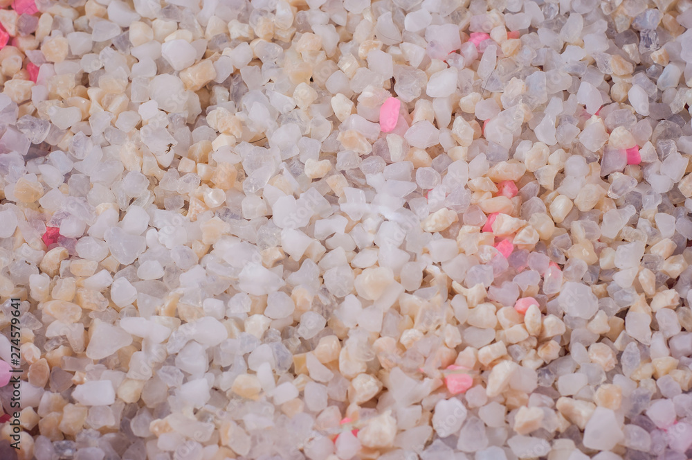 Silica gel cat litter with white and pink granules in active use Silica gel cat litter with white and pink granules in active use