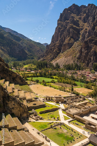View from Pumatallis terraces, in the Ollantaytambo archaeological site, of the Inca town: amazing ancient city, ruins and the beautiful green valley. Travel destination in the Sacred Valley, Peru
