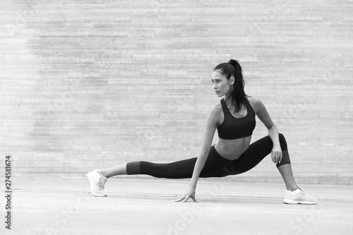 female fitness woman performing a twine