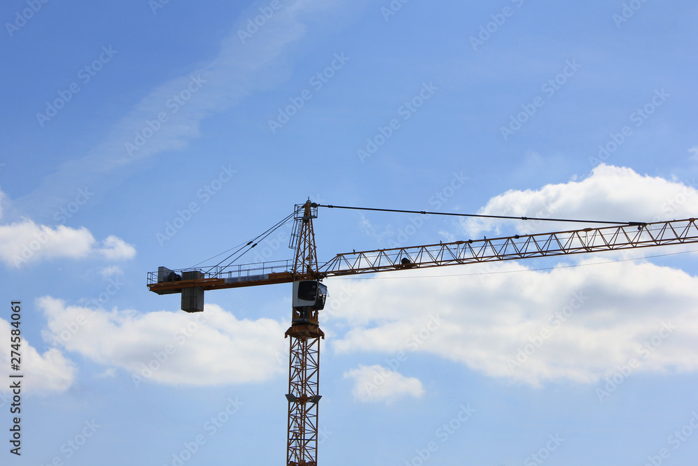 Construction crane on empty sky background outdoors 