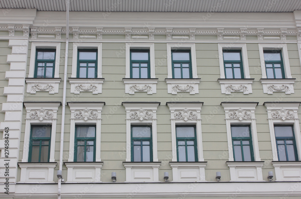 Fototapeta premium Historic old building facade in Moscow old town district, Russia. Classic russian city house exterior, front view of traditional european style building in russian capital 