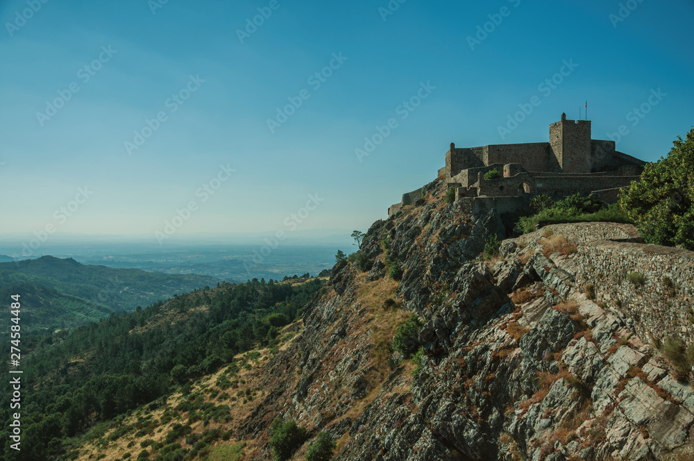 Stone wall and tower of Castle and mountainous landscape