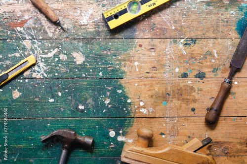 Vászonkép Flat lay set of vintage carpentry tools on colorful wooden background
