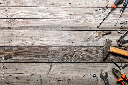 Tableau sur toile Flat lay composition with vintage carpentry tools on rough wooden background