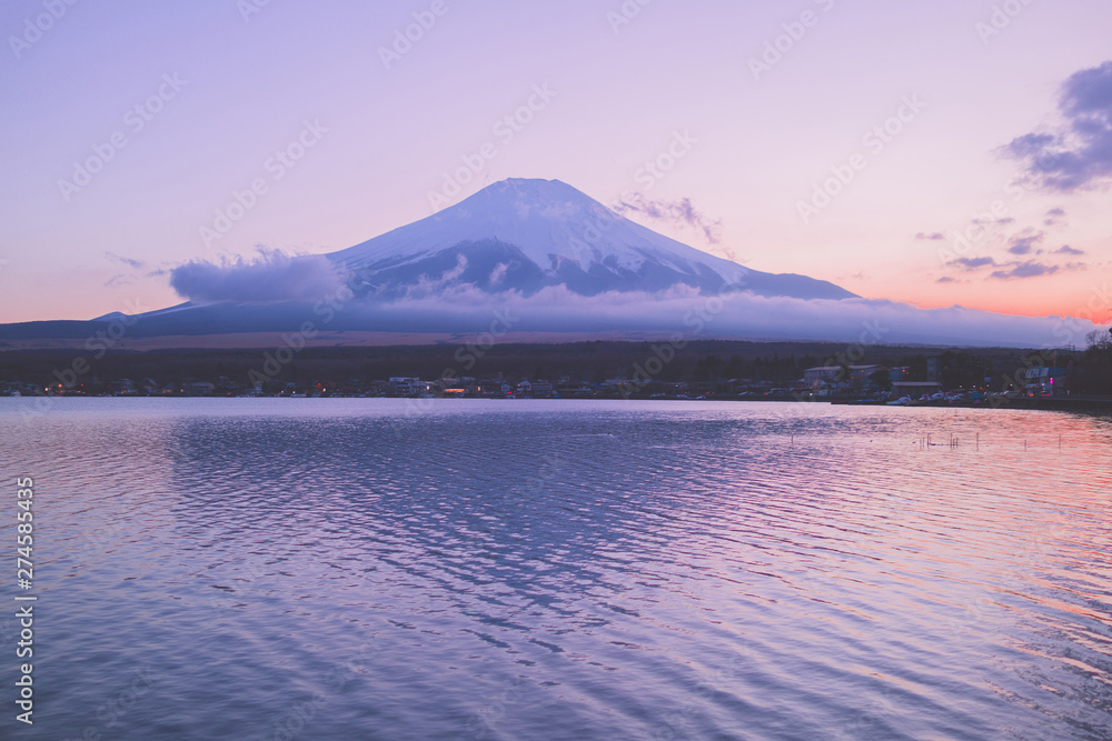 Mount Fuji in front of the lake at dusk
