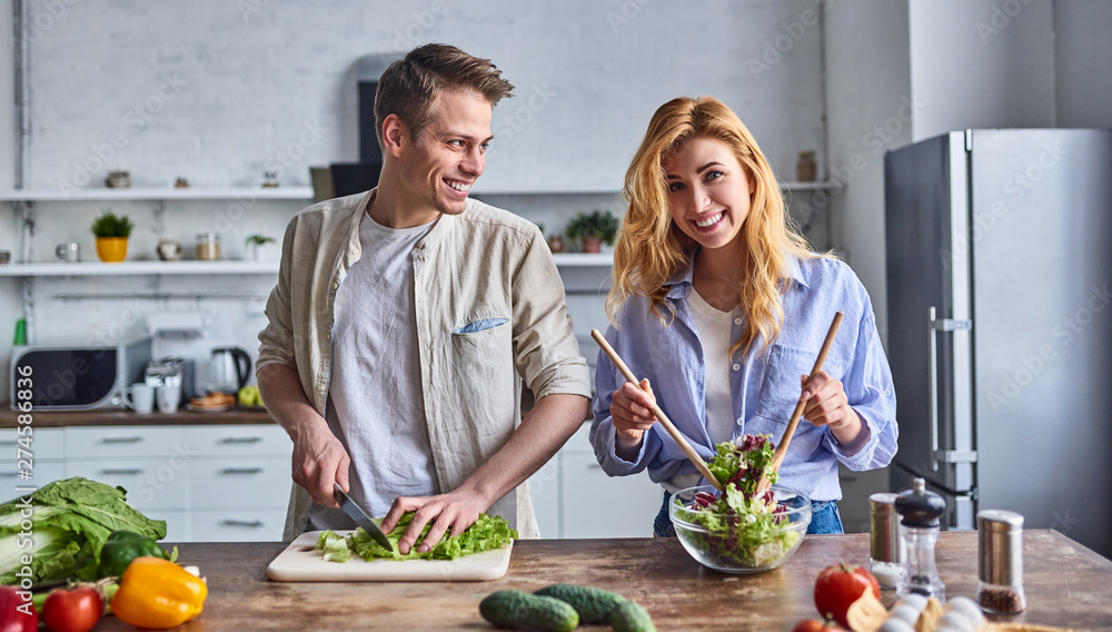 Young couple in the kitchen Young couple in the kitchen