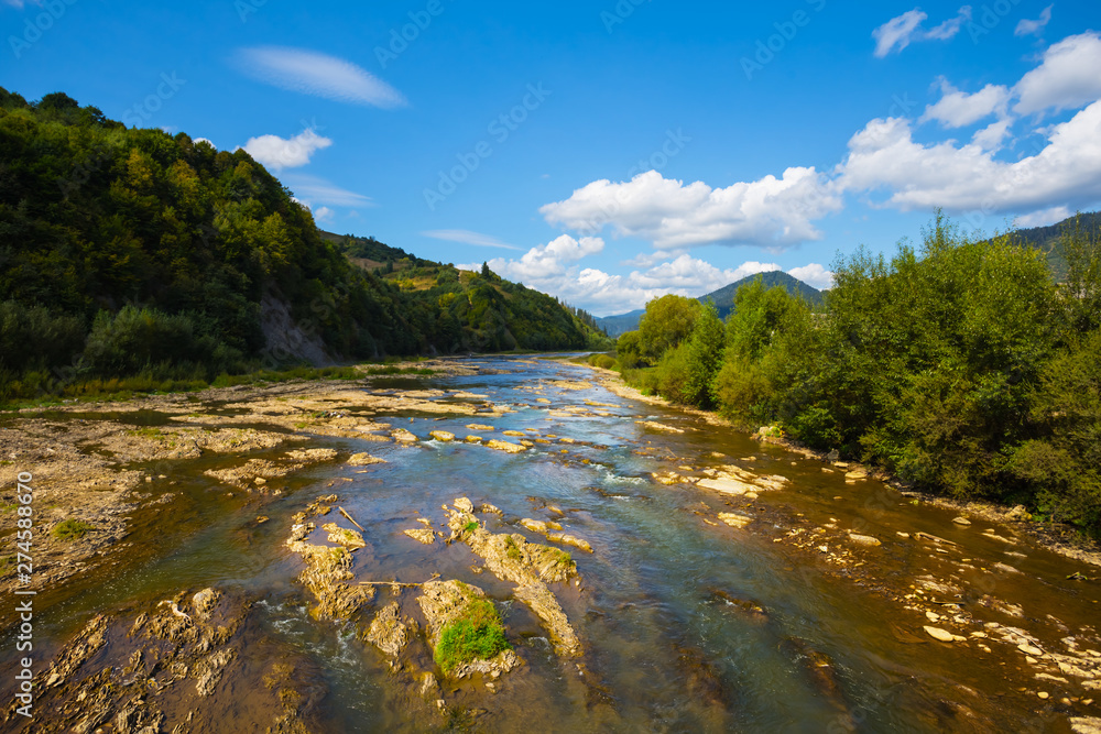river rushing through the mountain valley