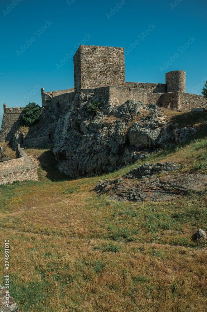 Walls and towers over rocky hill with garden at the Marvao Castle