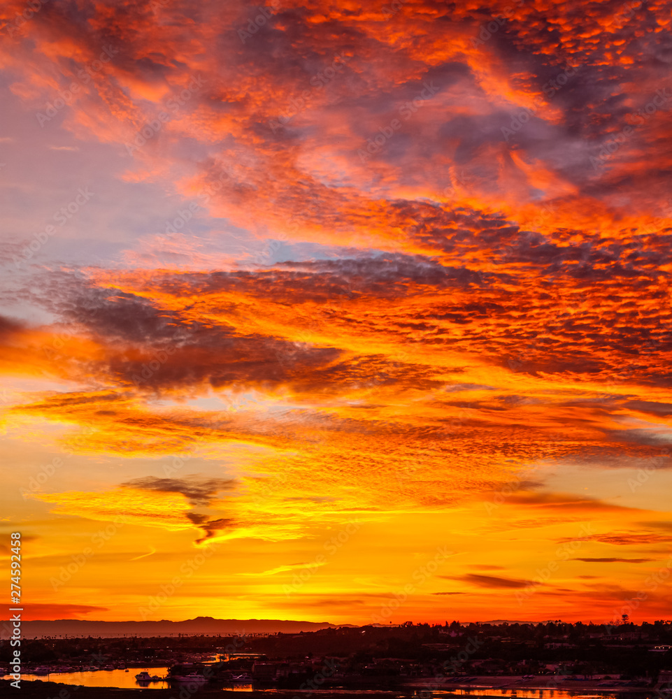 fiery dramatic orange cloud sunset over Catalina Island in California fiery dramatic orange cloud sunset over Catalina Island in California