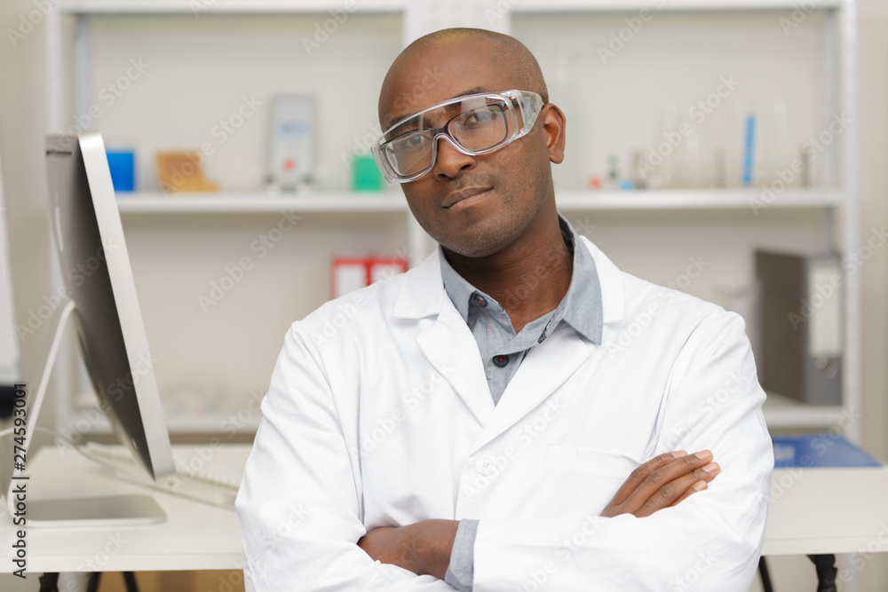 dental dentist standing with arms crossed