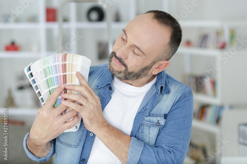 man holding a color swatch